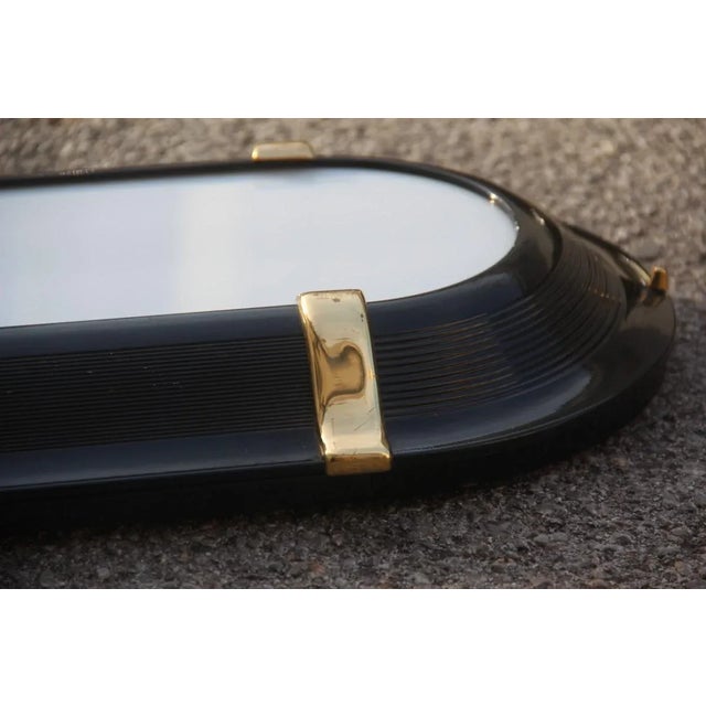 This black and gold Italian Sottsass style sconce has two neon lights and is very reminiscent of the Art Deco style of the...