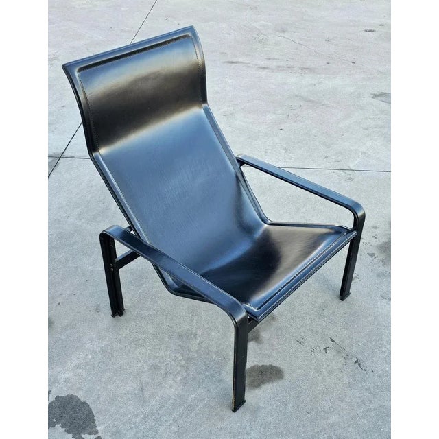 A very rare Postmodern lounge chair "Golfo dei Poeti" in black leather. It was designed by Jacques Toussaint and Patrizia...