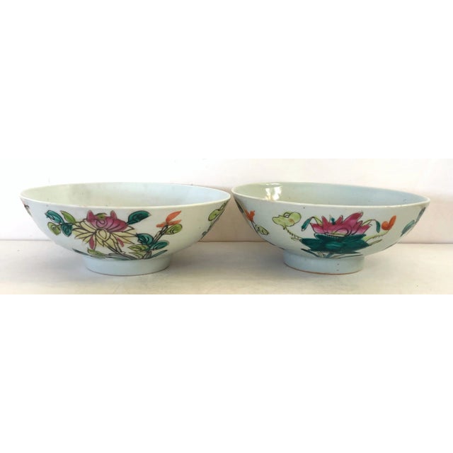 This early pair of country Chinese republic hand painted bowls are glazed in a grayish celadon background with floral...