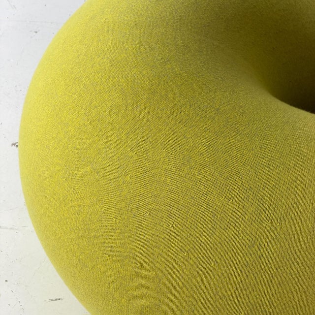 c. 2020s. Original upholstery. Donut pouf with full foam construction.