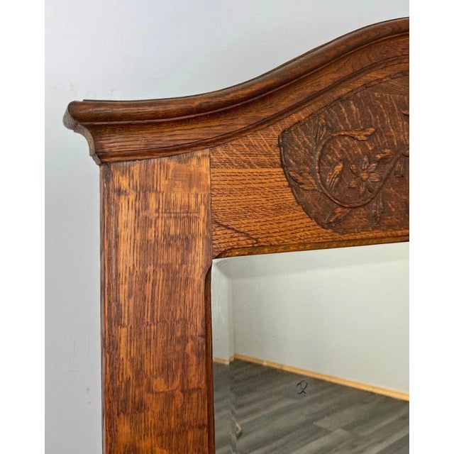 A Touch of Antique Charm This beautiful antique French mirror brings elegant period character with its deep oak tones and...