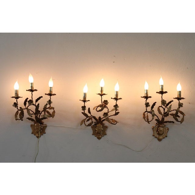 We present an elegant set of three wall lamps made in Italy in the second half of the 20th century. This pair of wall...