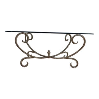 Vintage Hollywood Regency Style Coffee Table Featuring a Gold-Finished Wrought Iron Base With Scrollwork and an Oval Beveled Glass Top For Sale