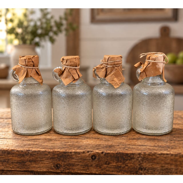 Wonderful matching set of four antique textured glass jugs, each bearing the IPG triangle mark attributed to Illinois-...