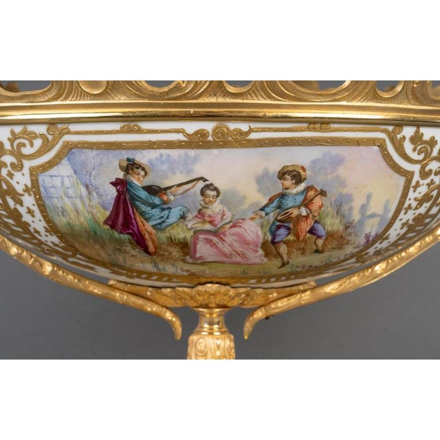 Beautiful 19th-century cup, louis xv style, napoleon iii period in painted porcelain and gilt bronze. H: 32cm - w: 50cm -...