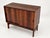 Sideboard in Santos rosewood, front with two sliding doors, behind which are shelves. Very good condition. Wall hangers on...