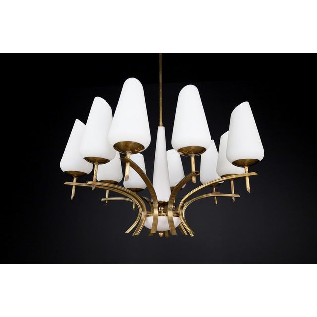 Elegant mid-century modern brass and opaline glass chandelier, france, 1950s a stunning example of french mid-century...