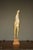An unusual sculpture in the surrealist style that uses the motif of a standing figure.
