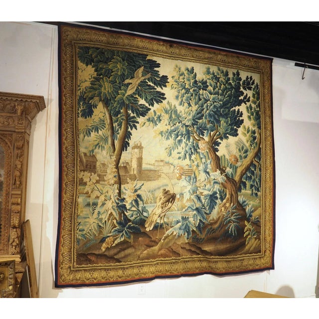Hand-woven in Flanders (part of modern-day Belgium) during the 1700s, this wool and silk tapestry features a thick canopy...
