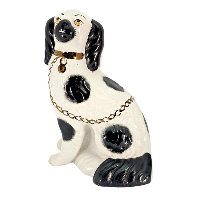 A matching pair of mid-twentieth-century English Staffordshire Revival spaniel mantel figures, dating to circa 1945–1960....
