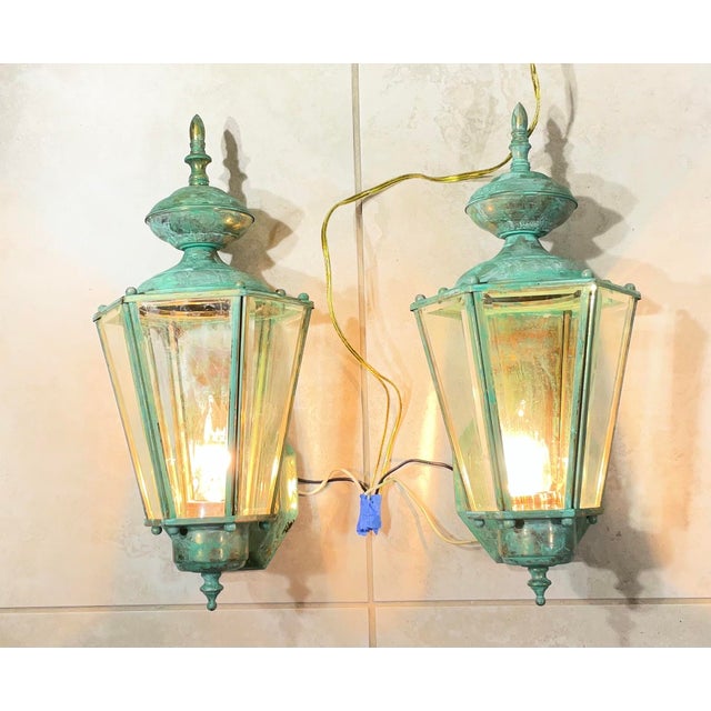pair of solid brass outdoor wall lanterns. high-quality brass fixtures with nice green patina that gives them a timeless,...