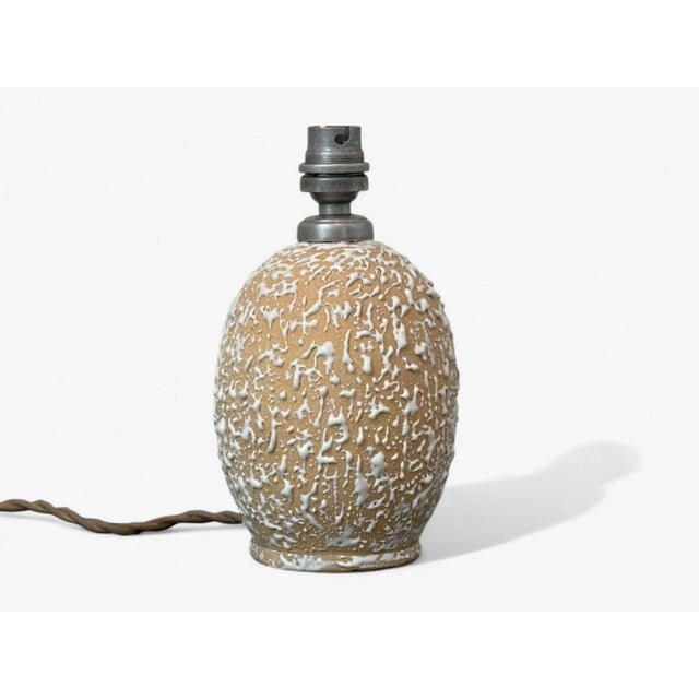 Jean Besnard, French Art Deco, Off-White Ceramic, Table Lamp, France, 1960s A small cream color ceramic partially glazed...
