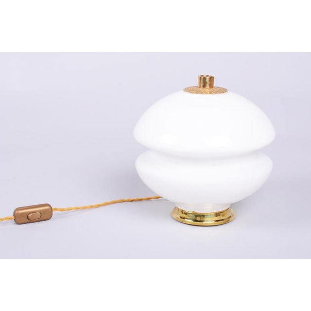 This 1960s table lamp is a striking example of Czechoslovak design, which placed great emphasis on organic shapes and...