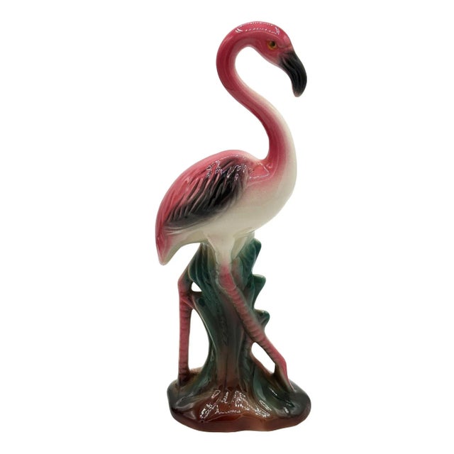 Mid-century pink and green long-legged "The Walker" flamingo ceramic figurine. The statue detailed a pink flamingo with...