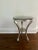 Pair of silver-leaf finish wooden round accent tables with antique mirror on top by Bliss Studio Lower round shelf is...