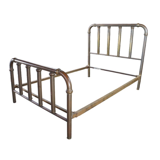 This Victorian full-size brass bed frame showcases the enduring elegance of turn-of-the-century metal craftsmanship. The...