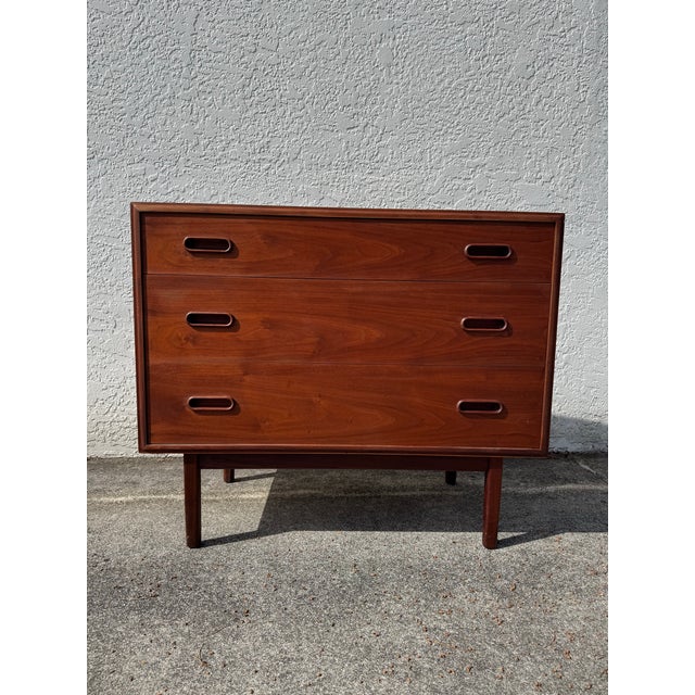 A beautiful mid century modern walnut three drawer dresser chest designed by Jack Cartwright for Founders. Circa 1960’s....