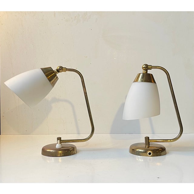 In the syle of Stilnovo and the French Modernist movement comes here a pair of wall lights fashioned from solid brass and...