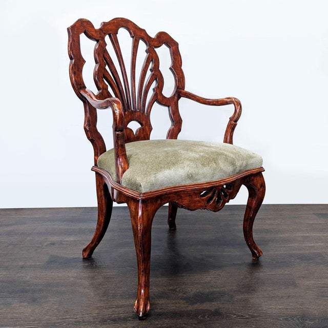 Elegant Chippendale-style armchair crafted in a rich mahogany finish with a pierced ribbon-back splat, carved shell...