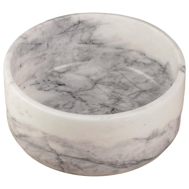 Handcrafted from richly veined white marble, the Joie Fruit Bowl is defined by its clean circular silhouette, substantial...