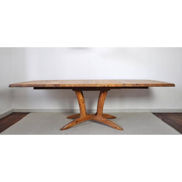 Large modern Scandinavian dining table in solid pine wood. Organically shaped legs, solid pine wood with a beautiful...