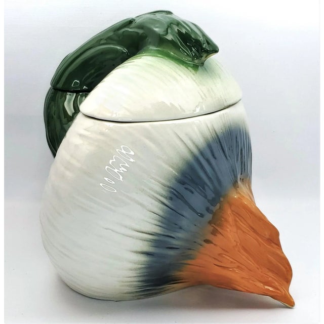 Offering a remarkable Italian porcelain cookie jar, or canister, circa 1960s. This amazing vessel is quite large and is...