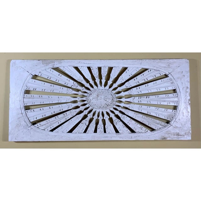 Beautiful hand carving wall hanging made from wood, with sun burst motif, hand painted in white color, with grayish accent...
