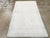 A vintage Indian Cotton Agra rug. Buff and light blue-grey tonally dominate this northern Indian scatter with an enormous...