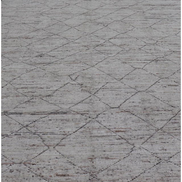 This modern casual tribal rug has been hand-knotted. The rug features a modern all-over sub-geometric diamond design,...