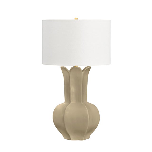 Bring warmth and elegance to any room with the Lyla Beige Glaze Ceramic Table Lamp. This charming piece features a hand-...