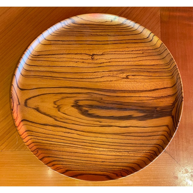 A Bob Stocksdale (American, 1913-2003) turned African zebra wood charger. Signed verso. Bob Stocksdale was an American...