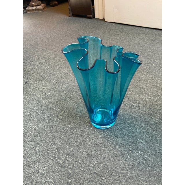 Blue glass vase. Ruffle edged vase. Would make a great center piece on any table.