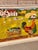 A delightful vintage naive folk art painting on wood of a rooster pulling an "Express" wagon loaded with harvest...