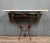 Superb Art Deco wrought iron console table, circa 1920 Travertine top Unique base with floral decoration Dimensions: H 96...