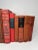 Set of 12 vintage and antique books in shades of red. Varying subject matters and sizes. Condition varies and most are...