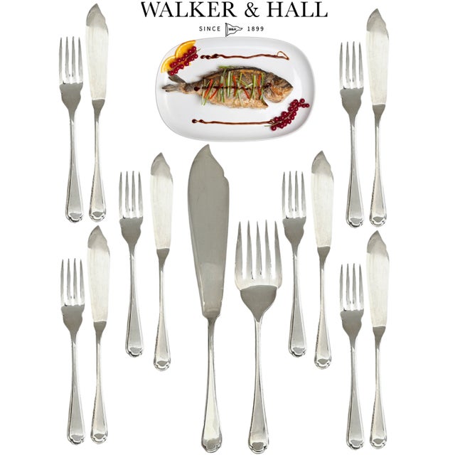 .A midcentury marvel with serious table presence. This 14-piece silverplate fish set by esteemed British silversmiths...