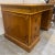 A distinctive and finely crafted vintage Sligh Furniture desk, made in warm knotty pine with a richly detailed Greek key...