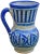 Handcrafted ceramic pitcher from Fez, Morocco with a hand-painted Moorish pattern in blue and white. Maker's mark on...