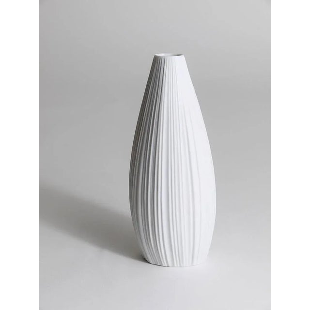 A beautiful white matte striped relief biscuit porcelain vase from the 1960s, designed by Martin Freyer, executed by...