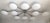 Italian midcentury flush mount with ten matte white Murano glass shades mounted on solid brass frame in polished chrome...