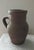 This charming vintage terracotta jug is a testament to the elegant simplicity of traditional Mediterranean or European...