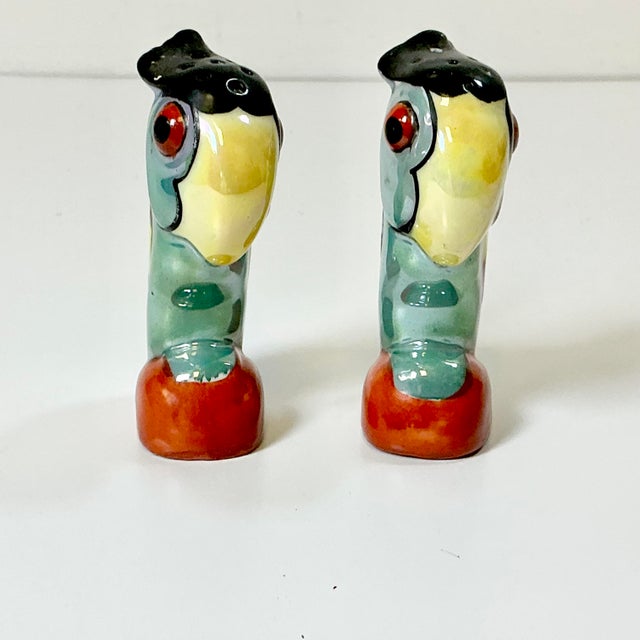 This is a delightfully whimsical pair of Toucan Salt & Pepper Shakers. The ceramic shakers are colorfully painted with an...