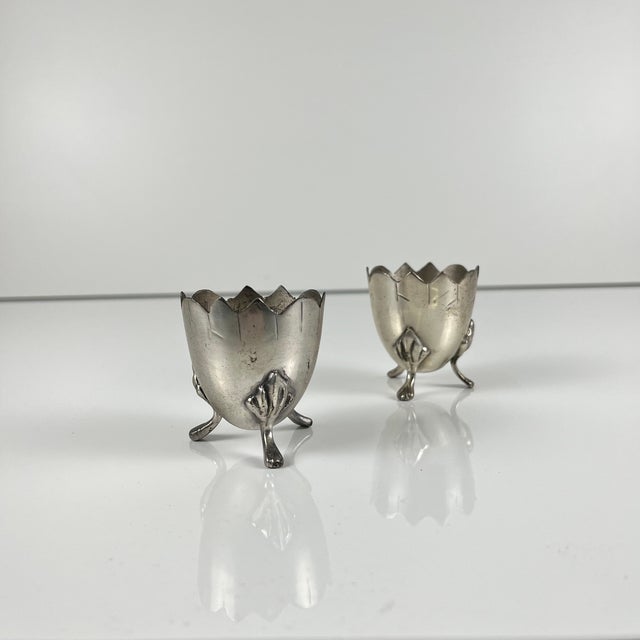 Pair of antique Art Nouveau tripod egg cups in nickel silver, circa 1900-1925 Dimensions: Height: 5 cm Diameter: 4.5 cm...