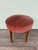Vintage pouf made in Italy in the 1950s. Small ottoman with a wooden frame and legs, and a padded seat upholstered in pink...