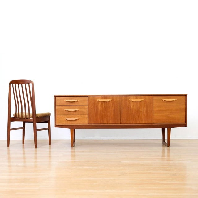 This vintage mid-century credenza was produced by Stonehill of London during the 1960s. A wonderful minimalist design and...