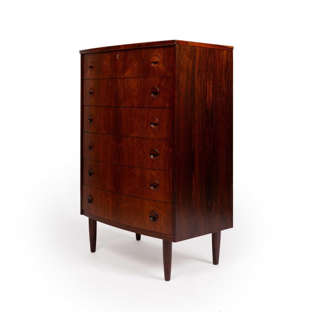 This exquisite rosewood tallboy dresser, crafted in Denmark during the 1960s, epitomizes the superior craftsmanship of the...