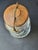 This beautiful vintage jar is made out of glass, wood and metal. It features a classic silhouette, and the wooden top can...
