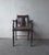 This antique piece is an Edwardian style barber's chair with adjustable back. Crafted from turned hardwood with a...
