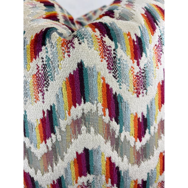 Custom pair of 22” pillows covered in a chevron cut velvet in a rainbow color pattern. These pillows have tapered corners...