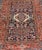 This lovely Antique Heriz rug, hailing from northwestern Iran (circa 1920s), features a central medallion design...
